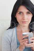 Close-up of a woman holding a mug