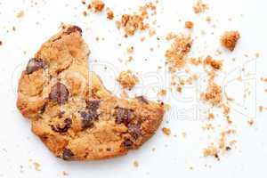 Close up of an half eaten cookie with crumb