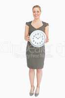 Woman holding a clock