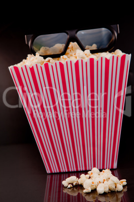 3D glasses on a box of pop corn