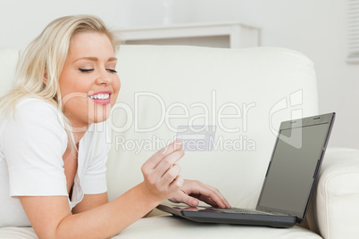 Woman with a credit card and a laptop