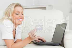 Woman with a credit card and a laptop