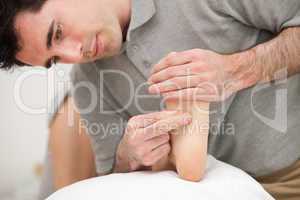 Chiropodist making a foot massage