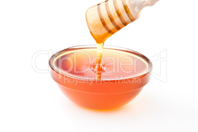 Honey dipper on top of a bowl