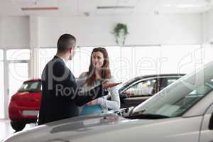Dealer speaking to a woman