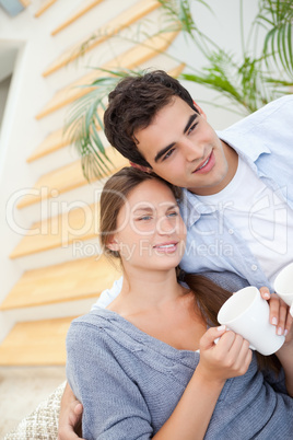 Young Couple smiling while embracing each other