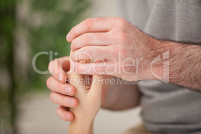 Hand of a patient being massaged