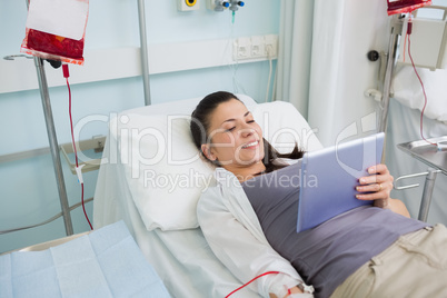 Female patient holding a tablet computer