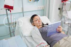 Female patient holding a tablet computer