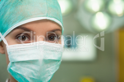 Close up of a woman wearing surgical gear