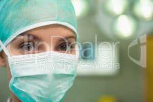 Close up of a woman wearing surgical gear