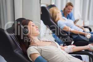 Patient listening music while being transfused