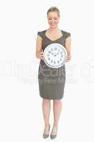 Woman showing a clock