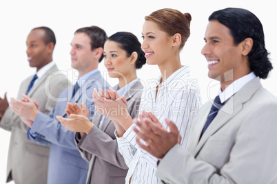 Close-up of business people smiling and applauding