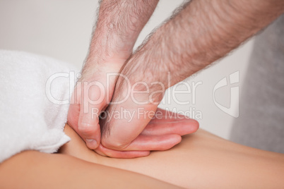 Practitioner massaging the thigh of his patient