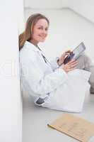 Doctor using an ebook while sitting
