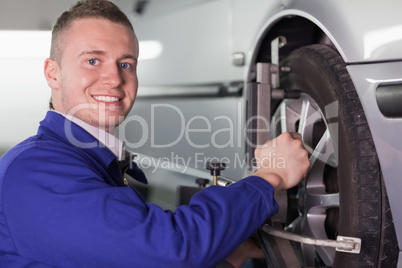 Mechanic changing a car wheel