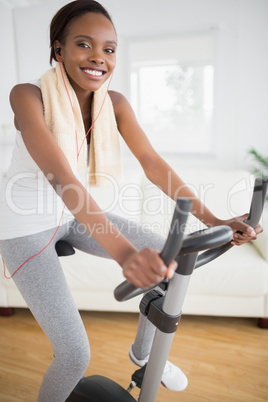 Black woman doing sport while looking at camera