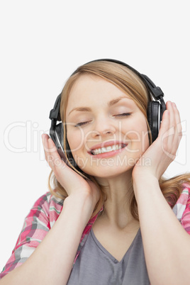 Woman with closed eyes listening music