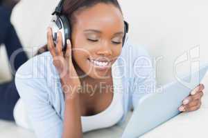 Black woman listening music with closed eyes
