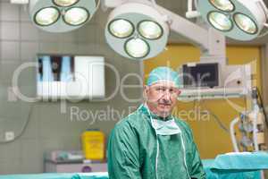 Sedate surgeon looking at camera