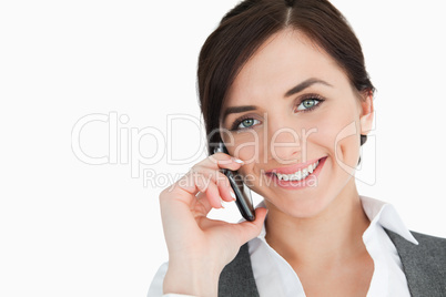 Happy businesswoman using a phone