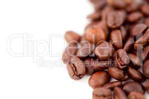 Dark blurred coffee seeds laid out together