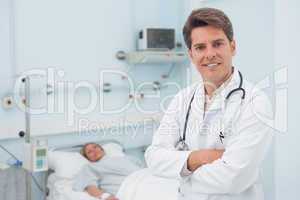 Doctor smiling with crossed arms