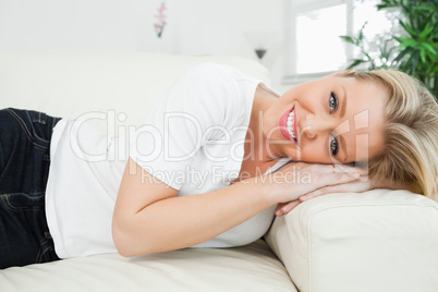 Woman resting her head on an armrest