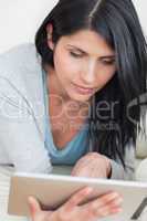 Close up of a woman playing with a tactile tablet