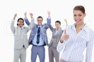 Close-up of a woman smiling and approving with enthusiastic busi