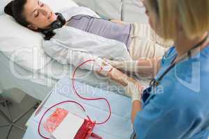 Nurse removing the transfusion