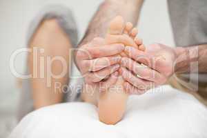 Sole of a foot being touched by a doctor