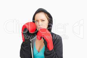 Serious woman boxing