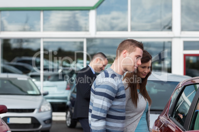 People buying a car