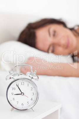 Alarm clock being placed on a nightstand