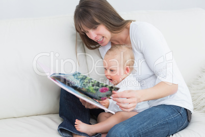 Mother reading a book with a baby