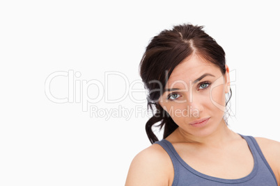 Unhappy young woman looking at camera
