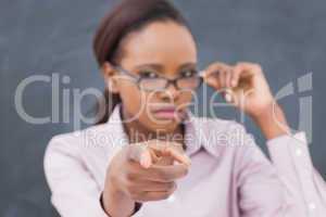 Focus on a strict black teacher pointing finger