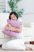 Woman holding a pillow