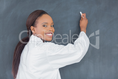 Black teacher holding a chalk