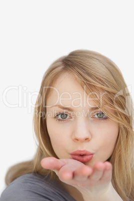 Woman blowing on her hand