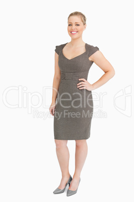 Businesswoman standing with a hand on her hip