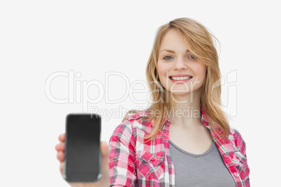 Woman showing a mobile phone