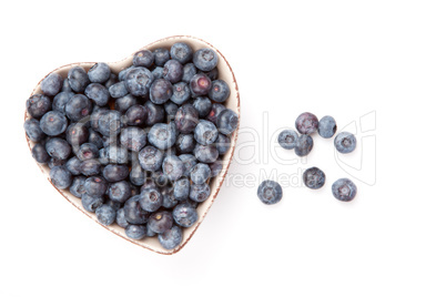 Fresh blueberries in  a heart shaped bowl