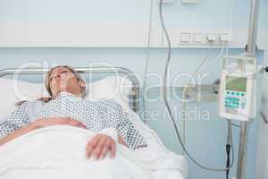 Woman sleeping on a medical bed