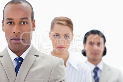 Big close-up of serious people dressed in suits in a single line