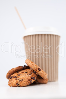 Cookies and a cup of coffee placed together