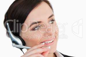 Woman in suit using a headset
