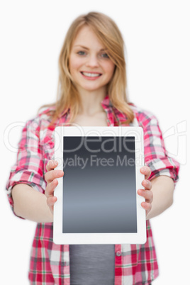 Woman showing a tablet computer at camera